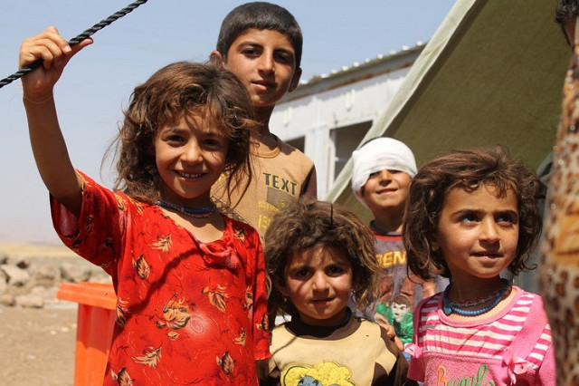 Iraqi refugee children at a camp in Syria. See Photo Credits.