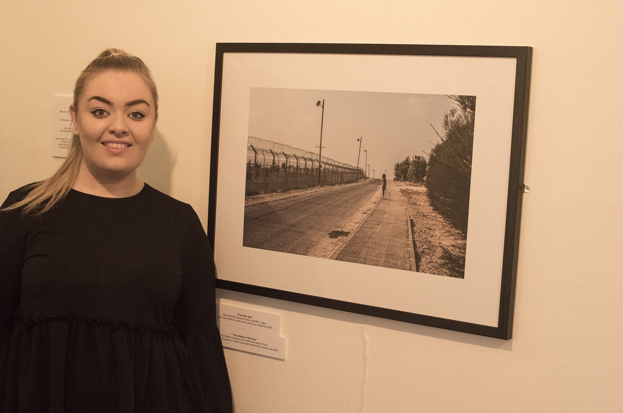 Grace Fryer with one of her evocative photographs depicting the suffering of Jewish children in Sderot.