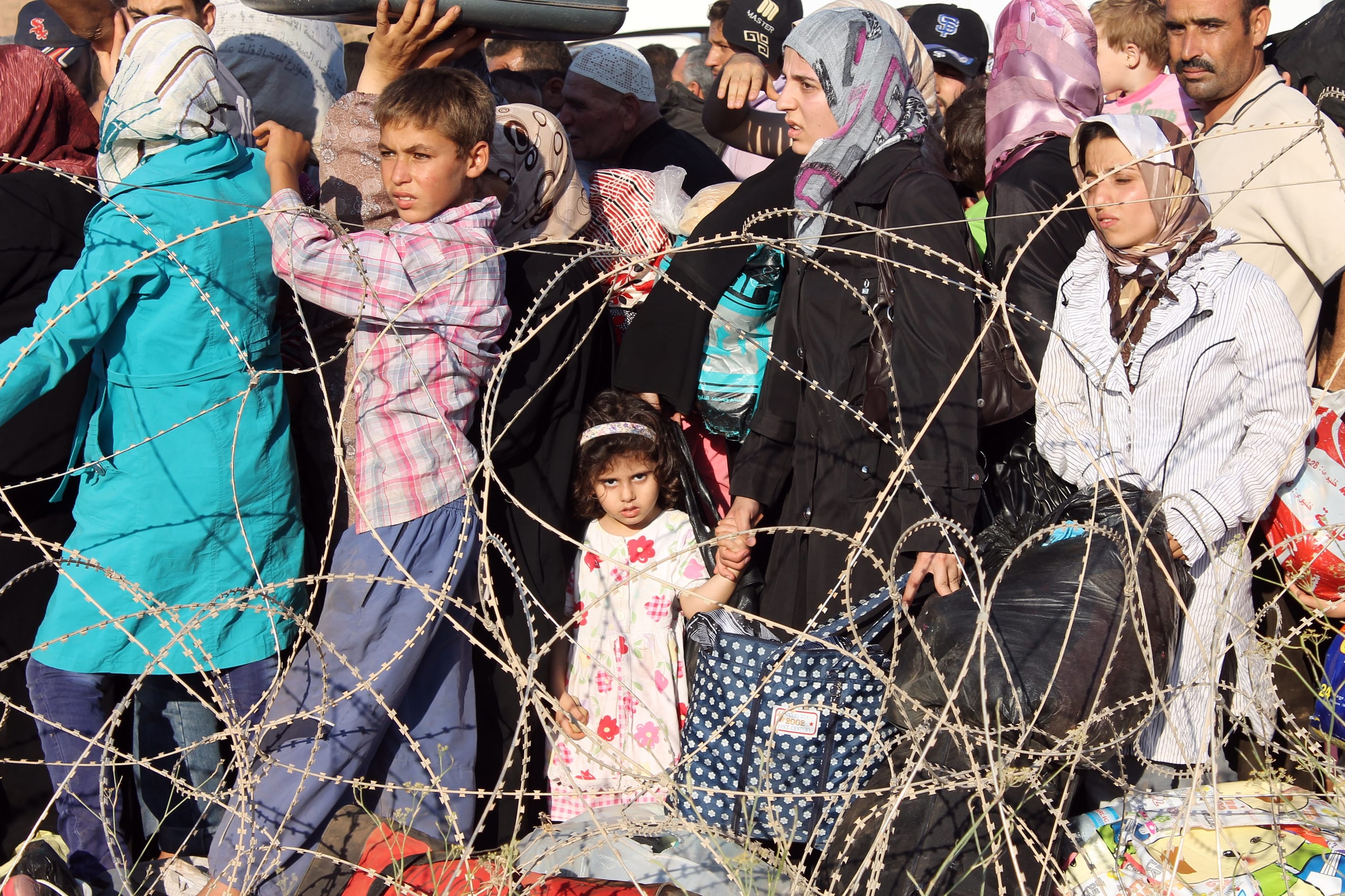 Syrians fleeing violence in their country crossed into Turkey, in Reyhanli, Hatay / See Photo Credits