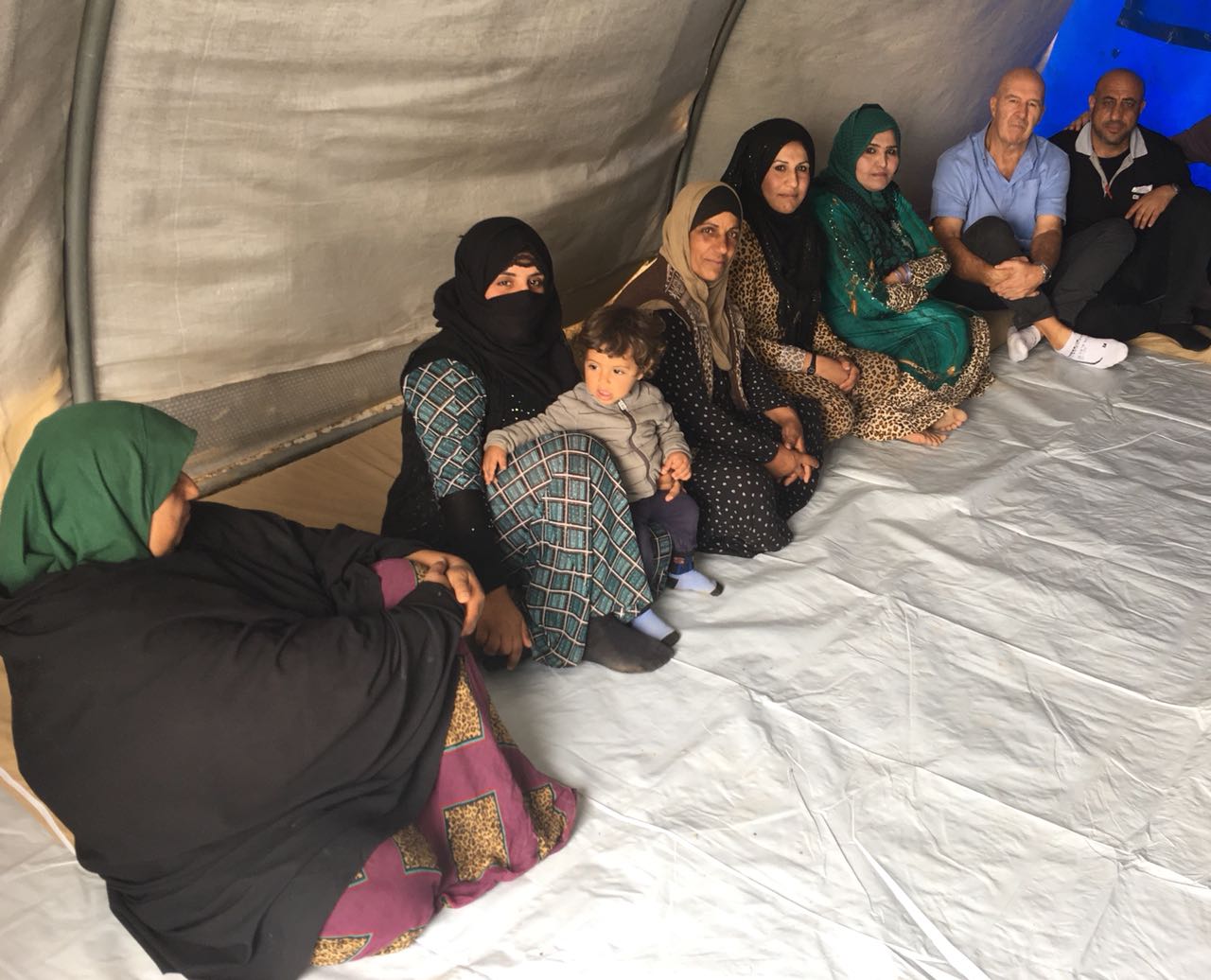 Muslim women in refugee camp who have lost everything to ISIS - including husbands and children. 