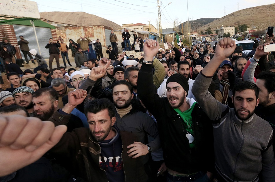 Anti-government protesters shout slogans against Assad, 28/12/15. See Photo Credits.