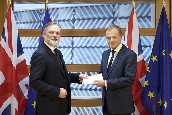 British Ambassador to the EU Tim Barrow handing over Theresa May's letter formally triggering Article 50. See Photo Credits.