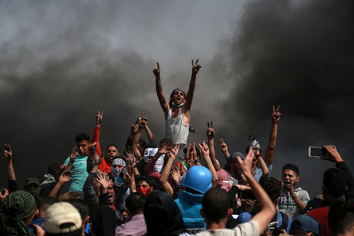 Palestinian protesters at the Gaza border. Stringer/Xinhua News Agency/PA Images