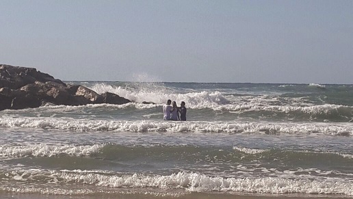 Yonatan Perry gets baptised in the Mediterranean Sea.