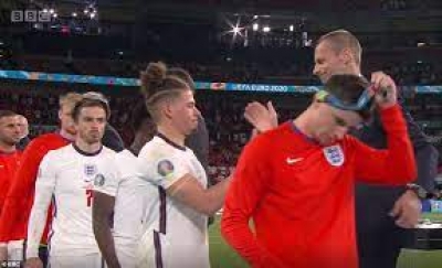 England players remove runners-up medals