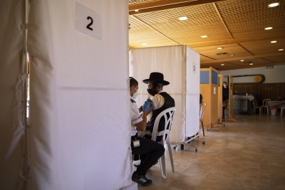 Orthodox Jewish man receives vaccine nr Jerusalem 