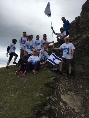 Hoisting the Israeli flag atop a Welsh mountain.