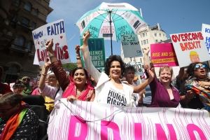 Protests against Trump&#039;s UK visit. Feminist, LGBT and anti-Brexit slogans visible.