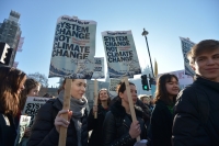 Pupil placards read: &#039;System change not climate change. One solution: revolution&#039;