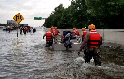 The Texas Army National Guard move through flooded Houston streets.