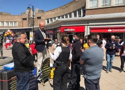 John Sherwood being confronted by the police