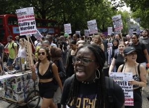 Demonstraters march in central London, Wednesday.