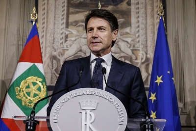 Giuseppe Conte addresses the media.