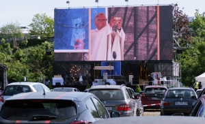 Church-goers attend a drive-in service in Germany